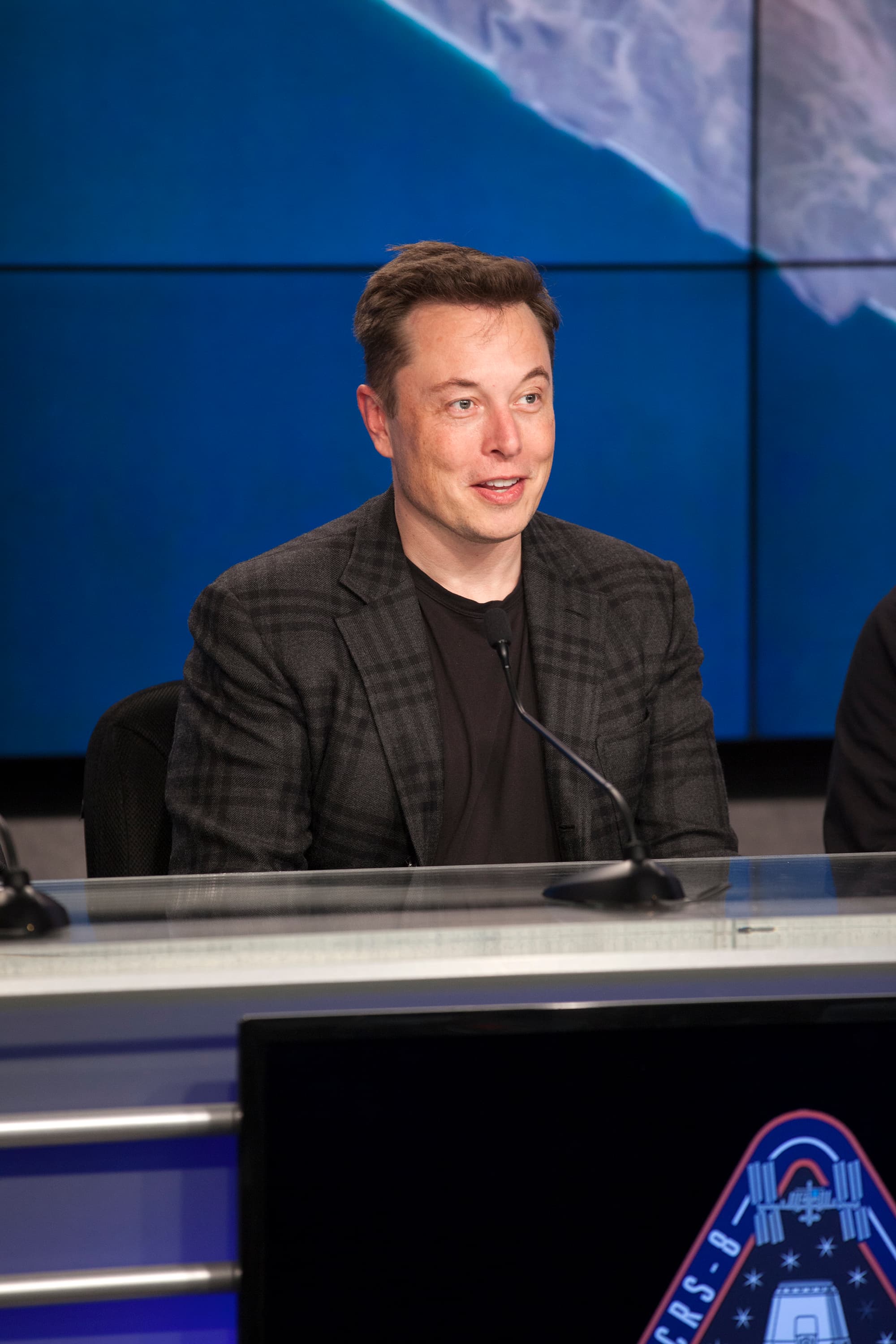 NASA/Kim Shiflett file photograph of Elon Musk at the April8,2016 SpaceX CRS8 press conference. It identifies the speaker; it does not show the GPU financing or a signing event.